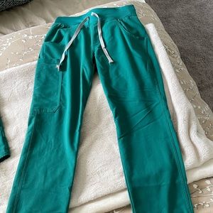 Figs Kade pants in Hunter Green.